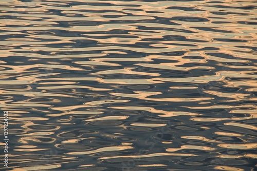The water surface of the river at sunset. The effect of moire silk. Background