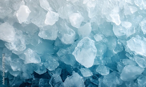 A close-up texture of crushed ice with shades of blue and white creating abstract shapes