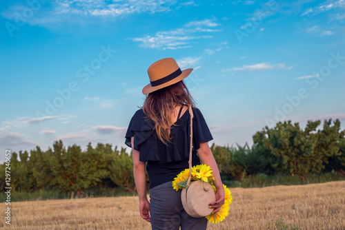Wallpaper Mural woman in hat nature background in bag sunflowers Torontodigital.ca