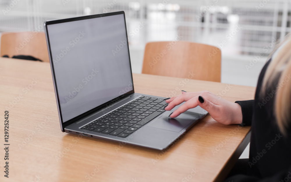Young white woman working on computer with blank copy space screen on table in home office. close up female businesswoman hands typing text, surfing internet on modern laptop. mock up, front view Young white woman working on computer with blank copy space screen on table in home office. close up female businesswoman hands typing text, surfing internet on modern laptop. mock up, front view
