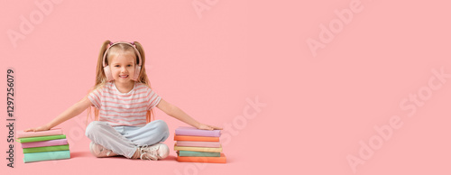 Cute little girl in headpho...