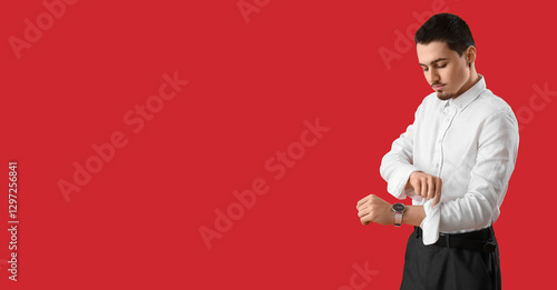 Young businessman rolling u...