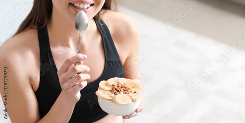 Sporty woman eating tasty y...