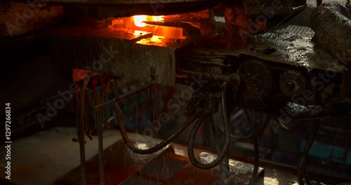 close-up of molten glass shaping into bottles in a high-temperature industrial factory, showcasing glowing material, precision molding, and automated glass production processes