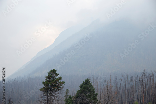 Obraz na płótnie Smoke from wildfires obscuring mountain view in glacier national park w salonie