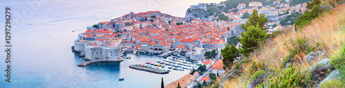 Obraz na płótnie Panoramic top view of the Old Town of Dubrovnik, banner, panorama in beautiful evening light at sunset, the Adriatic coast of Croatia w salonie