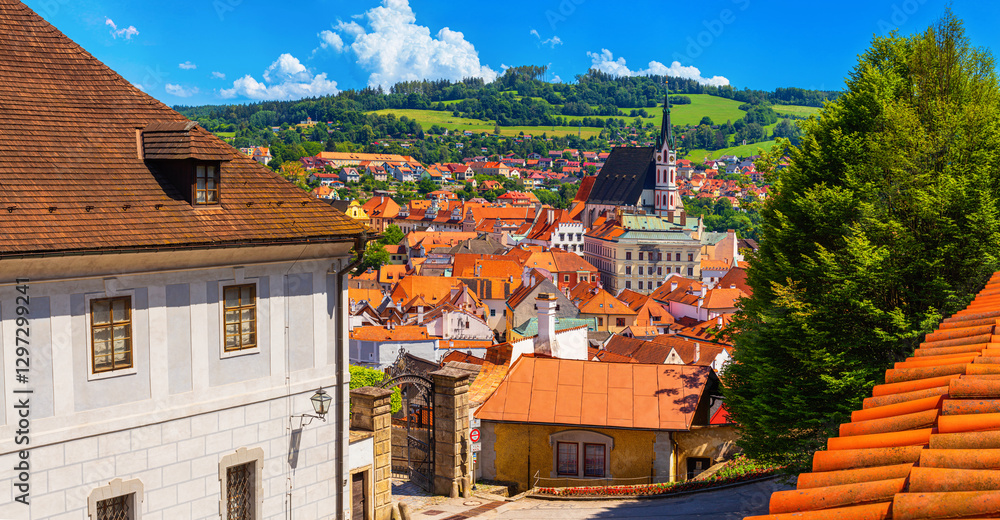 Summer cityscape - view from the Cesky Krumlov Castle to the historic centre Cesky Krumlov with St. Vitus Church, Czech Republic