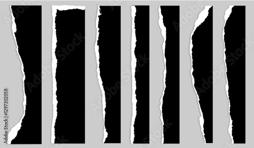 flat rectangular ripped black pieces of paper torn