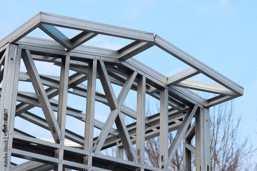 Obraz premium Lightweight steel thin-walled structures. Frames for warehouses, garages or houses. Structure of a steel frame for construction against the sky