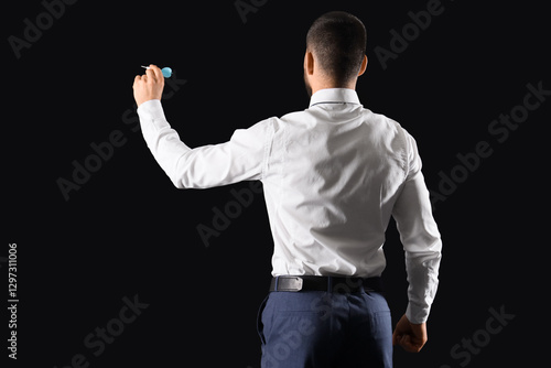 Businessman with dart on da...