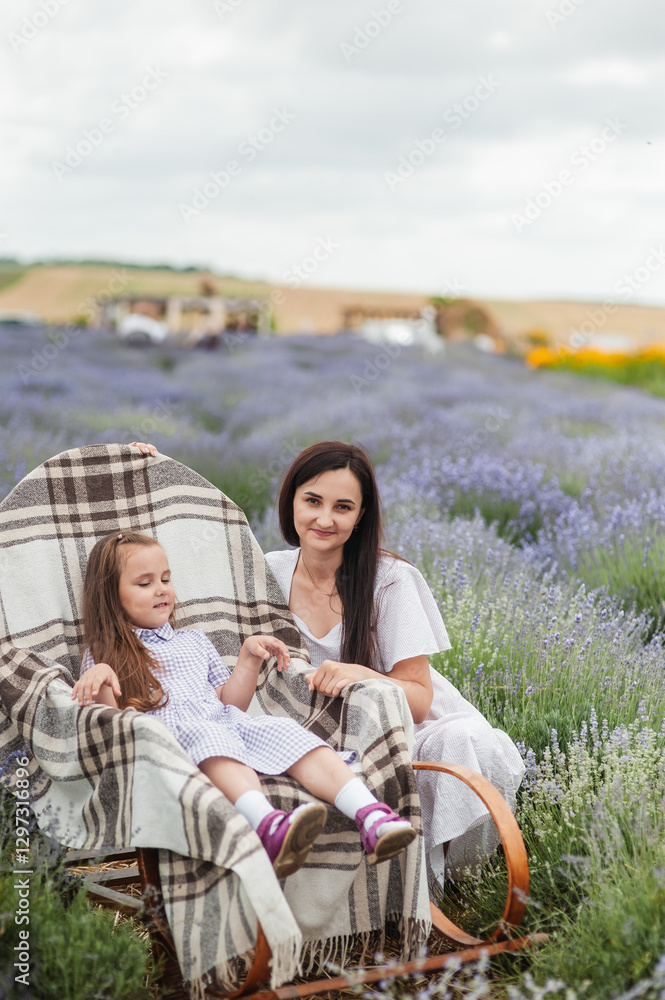 Happy family in flower field. young beautiful mother and child Girl enjoy walking blooming meadow on summer day. Dad having fun with pretty daughter in nature on sunset. mothers day. Happy family in flower field. young beautiful mother and child Girl enjoy walking blooming meadow on summer day. Dad having fun with pretty daughter in nature on sunset. mothers day.