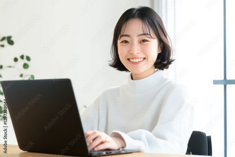 Woman working on laptop, home office Woman working on laptop, home office