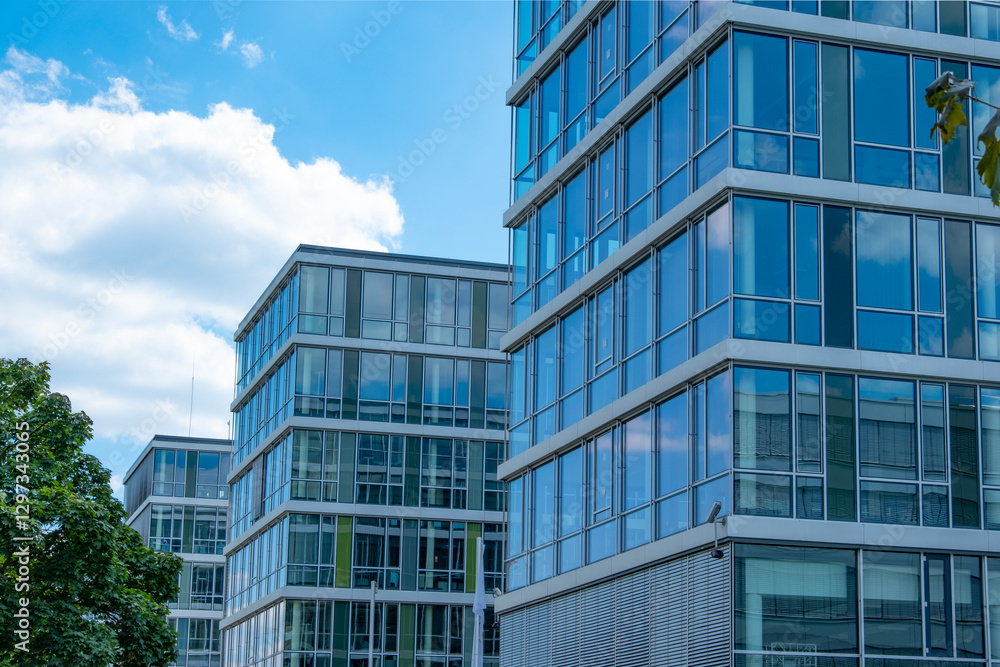 Multi-story modern glass buildings, residential and office, Vertical living meets corporate ambition, Concrete jungle, business district Multi-story modern glass buildings, residential and office, Vertical living meets corporate ambition, Concrete jungle, business district