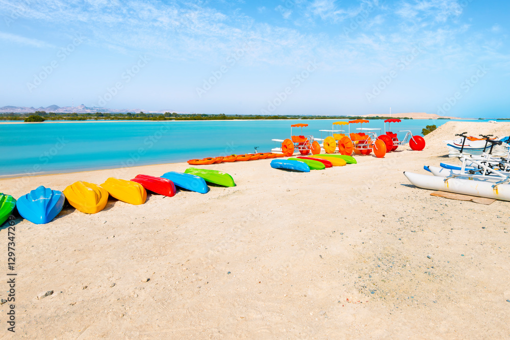 Watersport recreational vehicles on the sandy beach near the mangrove trees on the resort and wildlife sanctuary of Sir Bani Yas Island, Abu Dhabi, United Arab Emirates Watersport recreational vehicles on the sandy beach near the mangrove trees on the resort and wildlife sanctuary of Sir Bani Yas Island, Abu Dhabi, United Arab Emirates
