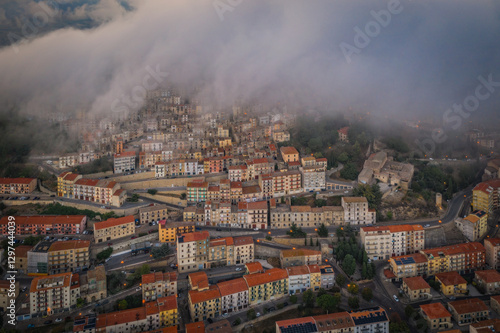 Wallpaper Mural Sunrise view of the rooftops of Gangi with morning fog. Sicily, Italy. August 2024. Aerial drone picture. Torontodigital.ca