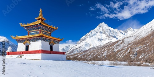 Wallpaper Mural A serene mountain landscape featuring a colorful temple surrounded by snow-covered peaks and a clear blue sky. Torontodigital.ca