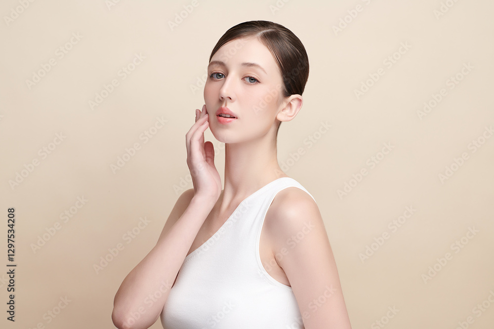 Beautiful young woman with clean fresh skin on beige background, Face care, Facial treatment, Cosmetology, beauty and spa, women portrait. Beautiful young woman with clean fresh skin on beige background, Face care, Facial treatment, Cosmetology, beauty and spa, women portrait.