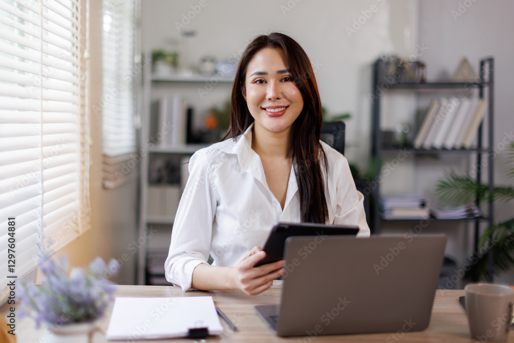 Asian businessman with a tablet laptop computer and documents. Freelance and selfemployment concept
Asian businessman with a tablet laptop computer and documents. Freelance and selfemployment concept