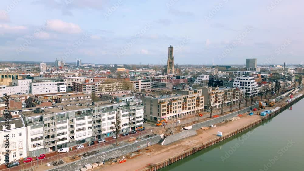 Sweeping aerial view of Arnhem, highlighting its dense urban layout, historic church, and contemporary buildings. Arnhem, Gelderland, Netherlands. Sweeping aerial view of Arnhem, highlighting its dense urban layout, historic church, and contemporary buildings. Arnhem, Gelderland, Netherlands.