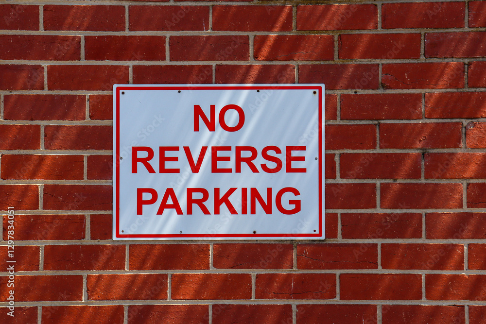 no reverse parking sign on brick wall no reverse parking sign on brick wall