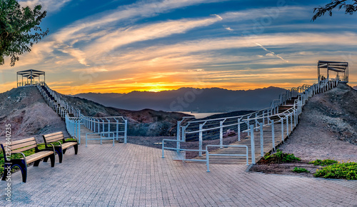 Wooden steps leading to observation point on the top of stone mounts. Desert ...