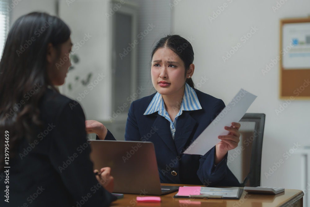 Businesswomen having a disagreement during a meeting in the office Businesswomen having a disagreement during a meeting in the office