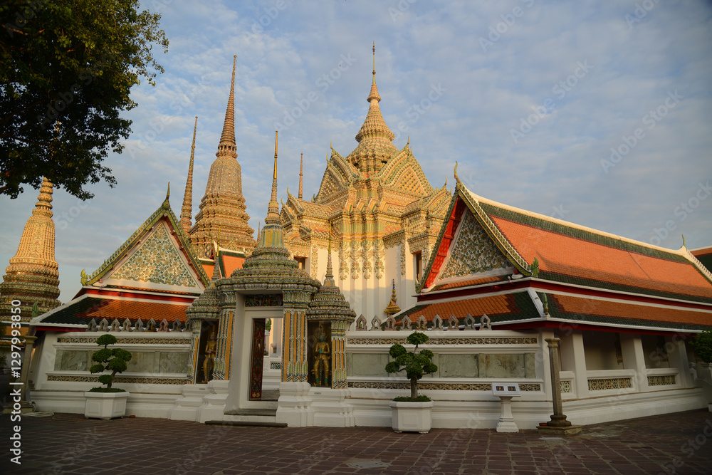 Naklejka premium Scenic evening time of Classic Thai architecture with pagoda in Wat Phra Chetuphon or Wat Pho. Which is one of the largest and oldest temples and is popular with both Thai and foreign tourists.