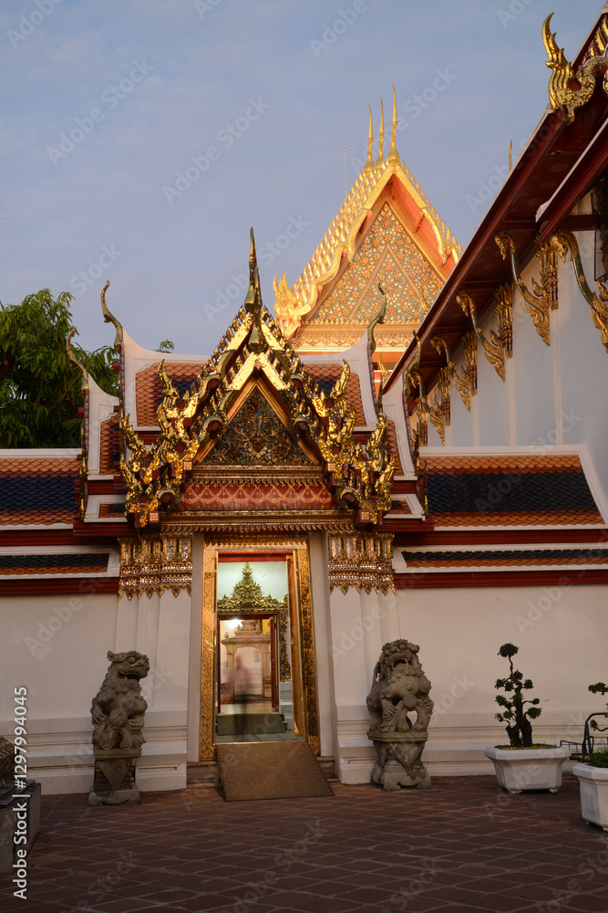 Naklejka premium Scenic evening time of Classic Thai architecture with pagoda in Wat Phra Chetuphon or Wat Pho. Which is one of the largest and oldest temples and is popular with both Thai and foreign tourists.