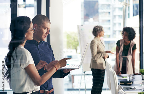 Free Download Laptop, talking and teamwork with business people in office for meeting or planning together. Collaboration, conversation and woman pointing at computer with man in workplace for project management - GFXLoad