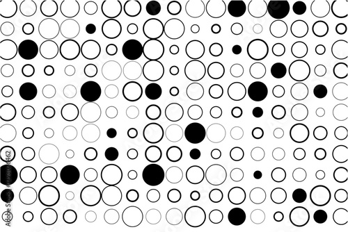 Abstract grid of circles with random black fills