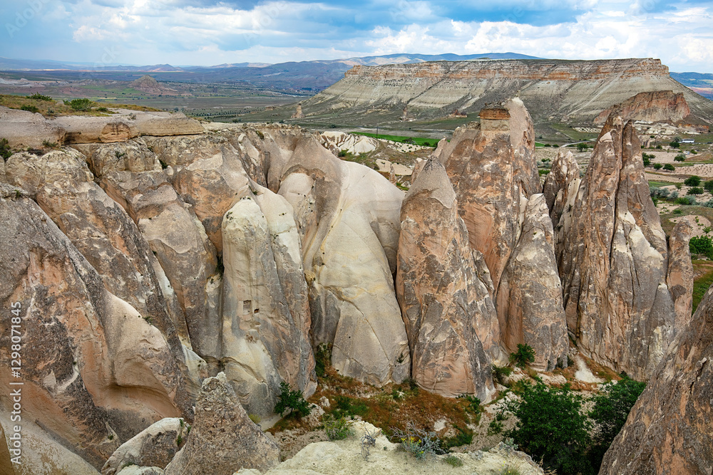 Majestic rock formations rise dramatically in the stunning Cappadocia landscape.