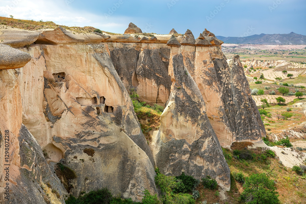 Unique rock formations stand majestically in Cappadocia's enchanting landscape.
