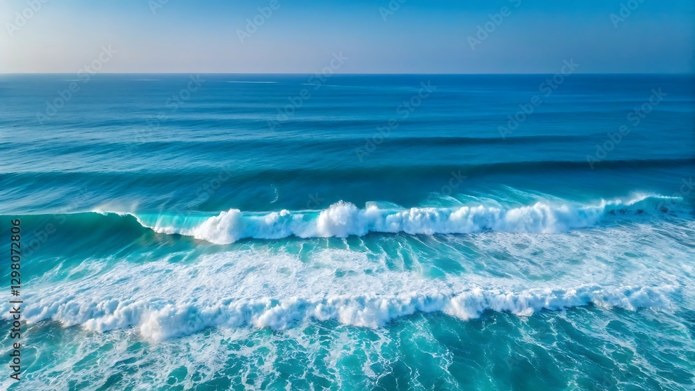 Obraz premium Clear blue ocean waves crashing on the sandy beach under a bright sky