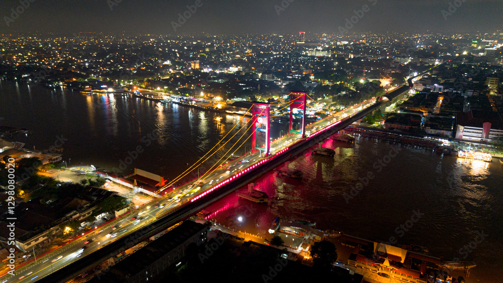 Obraz premium Aerial shot of Ampera Bridge at night, one of the landmarks of Palembang city, South Sumatra, Indonesia