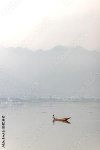 A view of Dal Lake in summer, and the beautiful mountain range in the background in the city of Srinagar, Kashmir, India. photo