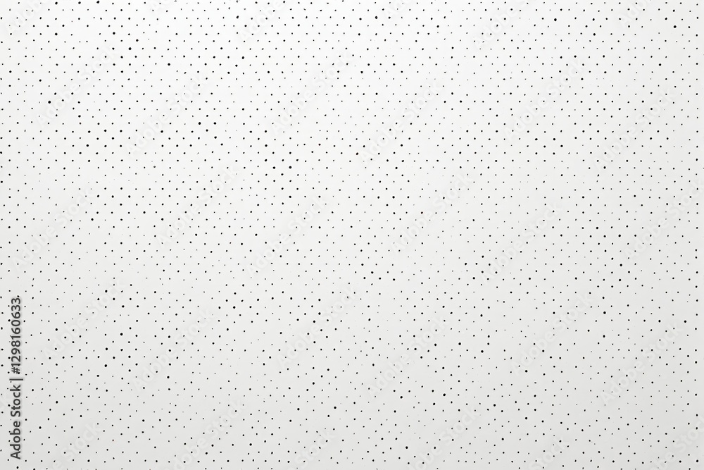 a close up of a white sheet of paper with black dots a close up of a white sheet of paper with black dots