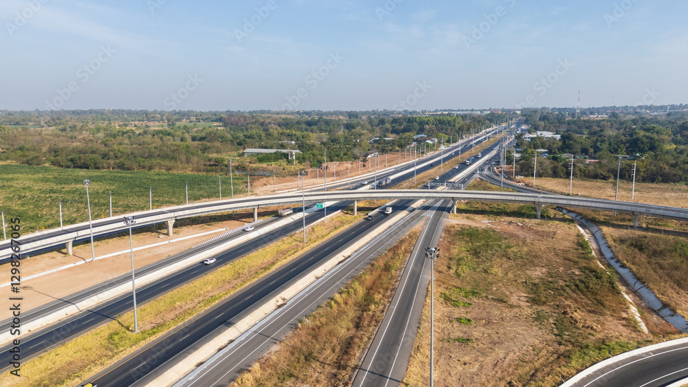 Drone shot aerial view of high angle view of intersection across the bridge against the countryside highway Drone shot aerial view of high angle view of intersection across the bridge against the countryside highway