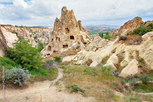 Obraz na płótnie Majestic rock formations and ancient dwellings create a mystical landscape in Cappadocia. w salonie