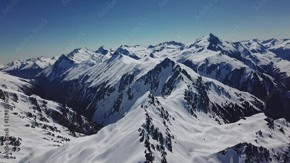snow-covered mountain range under a clear, bright sky. Majestic peaks and ridges create a breathtaking landscape snow-covered mountain range under a clear, bright sky. Majestic peaks and ridges create a breathtaking landscape