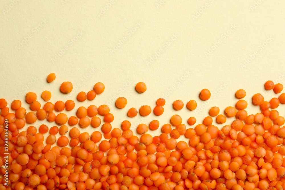 Fototapeta premium Red lentils on color background