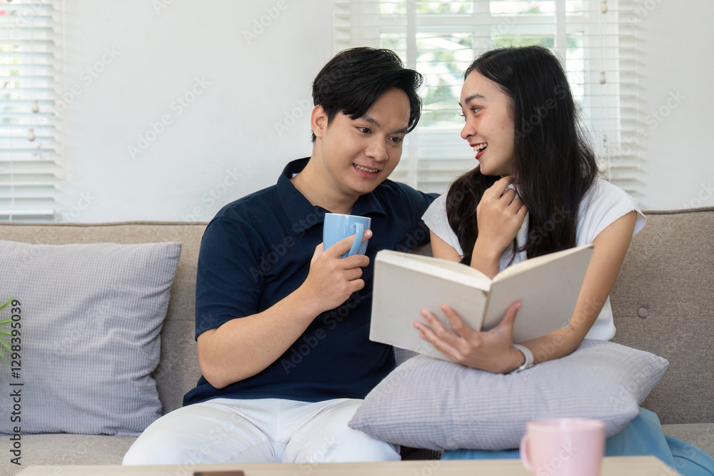 Couple enjoying a cozy reading session at home, sharing smiles and warmth. Couple enjoying a cozy reading session at home, sharing smiles and warmth.