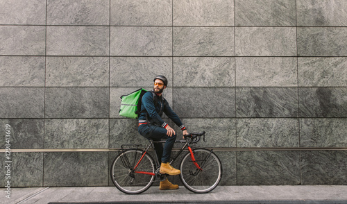 Fényképezés Food delivery rider on his bicycle