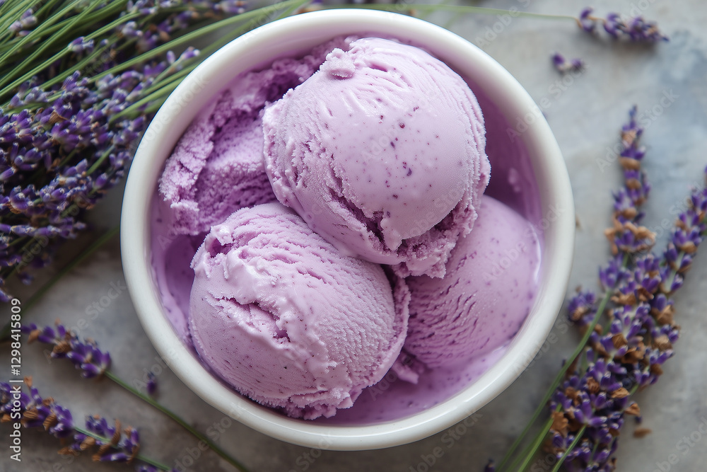 Creamy lavender honey ice cream scoops in white bowl, surrounded by fresh lavender flowers, creating rich and smooth texture. delightful treat for dessert lovers