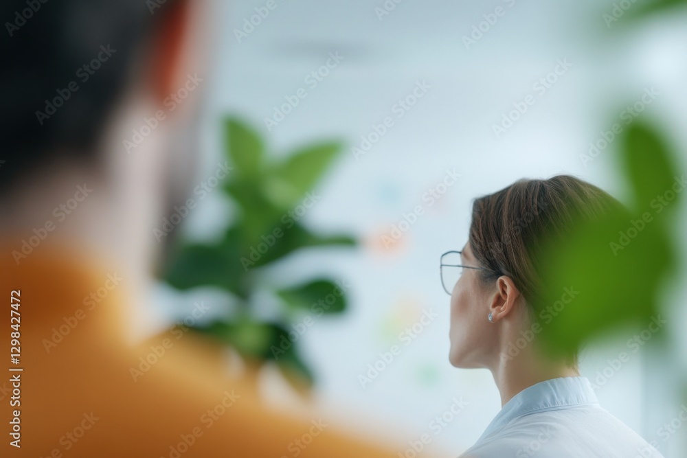Business Meeting with a Woman Looking at a Board