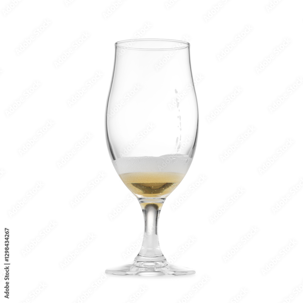 Fototapeta premium Almost empty glass of beer isolated on white