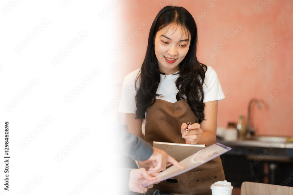 Asian female barista wear apron at counter bar with smile face, cafe service concept, owner business start up. Asian female barista wear apron at counter bar with smile face, cafe service concept, owner business start up.