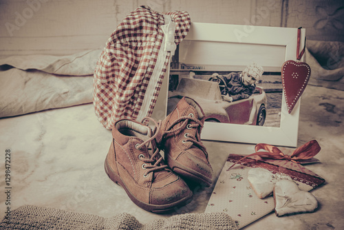 The first pair of shoes, photo, hat and other memories of moments of babyhood and childhood photo