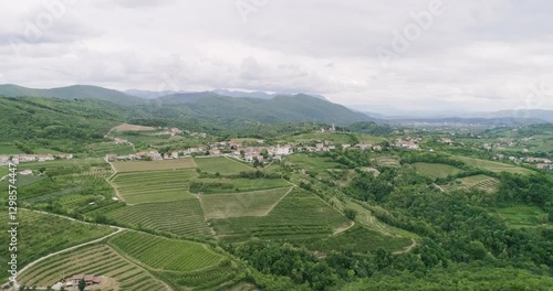 Aerial drone view pan of the Collio hills, Cormons, Nova Gorica near Gorizia. European Capital of Culture 2025. Typical local products vineyards and wines. Gonjače Tower places to visit and tradition.