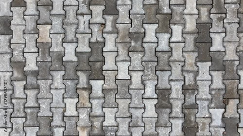 Top view of interlocking paving stone texture. Outdoor concrete slab pavement high quality drone image