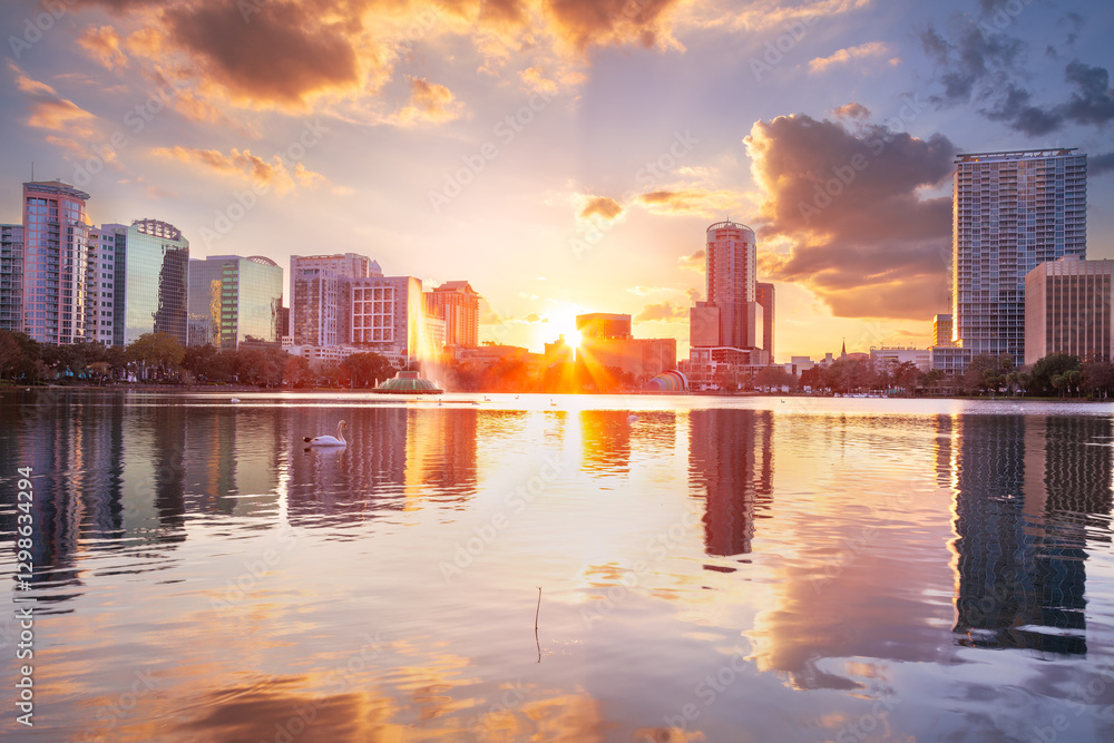 Orlando, Florida, USA. Cityscape image of Orlando, Florida with reflection of the city skyline in the water at beautiful sunset.